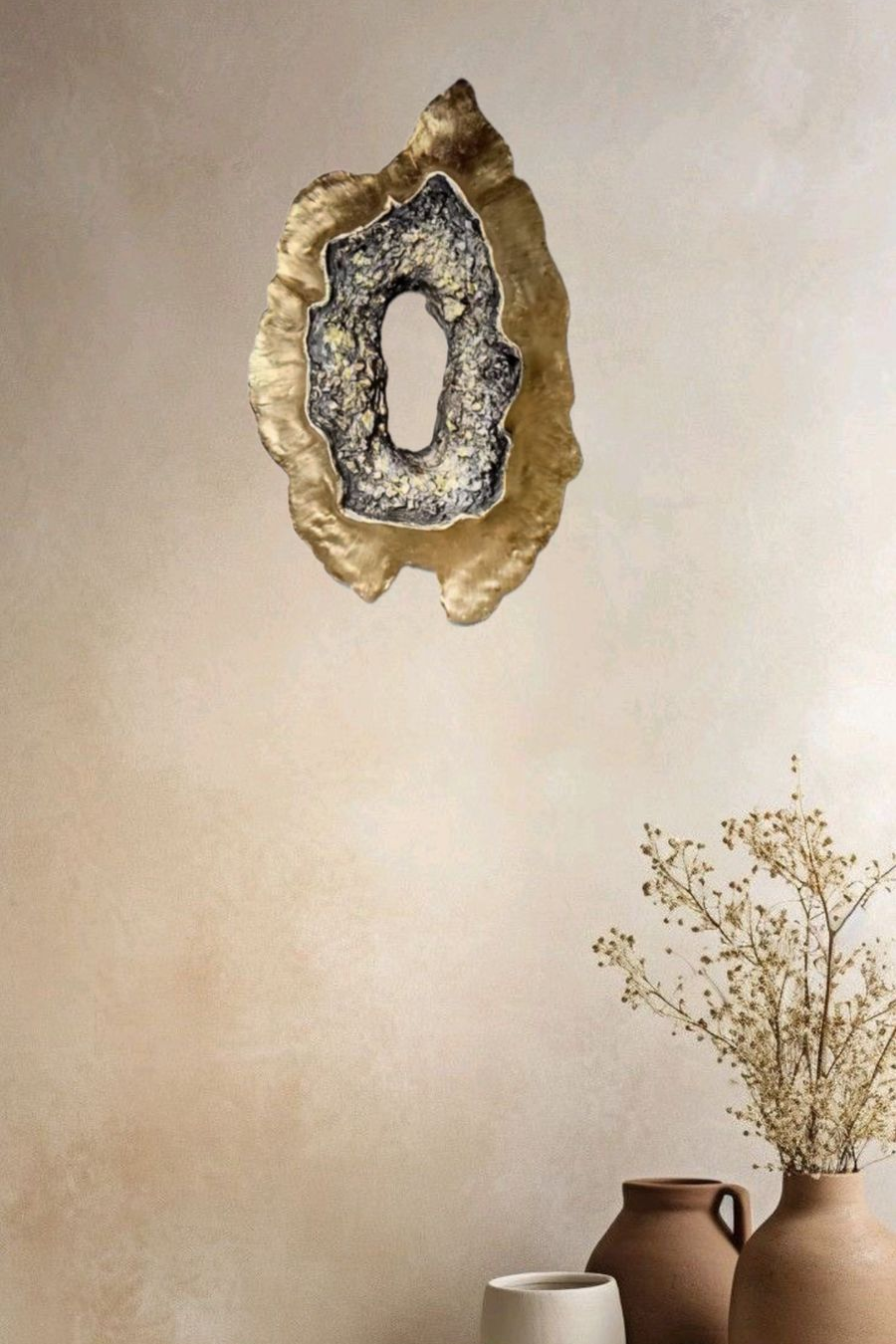 Luxury handcrafted geode-inspired gold textured wall sculpture mounted above a green velvet sofa in a modern living room – Arty Crafty wall art